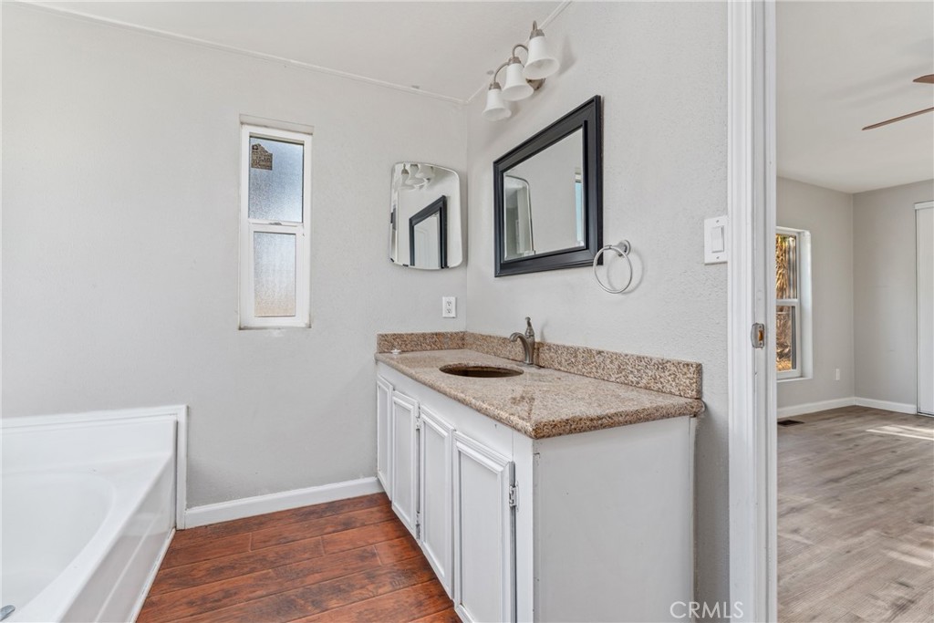 6320 Cholame Road Phelan, CA 92371 - Photo 17 of 33 a bathroom with a sink and a mirror