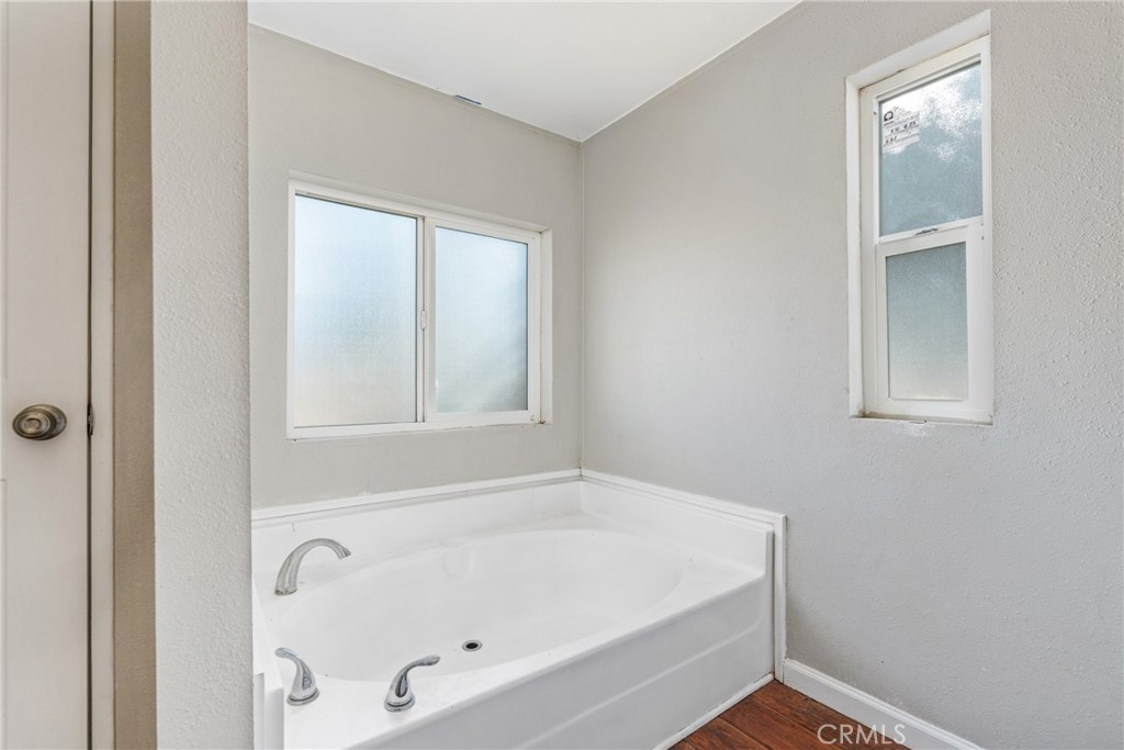 6320 Cholame Road Phelan, CA 92371 - Photo 18 of 33 a white bath tub sitting next to a window