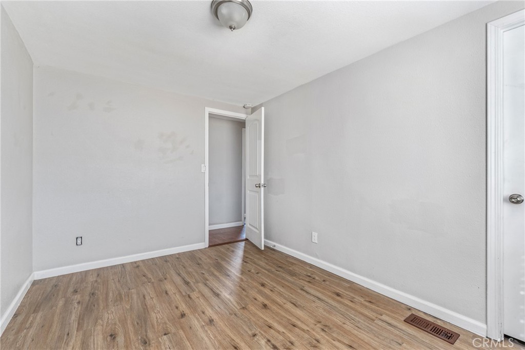 6320 Cholame Road Phelan, CA 92371 - Photo 21 of 33 a view of a room with wooden floor
