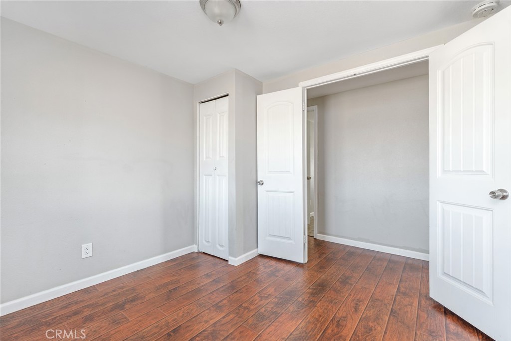 6320 Cholame Road Phelan, CA 92371 - Photo 26 of 33 a view of an empty room with wooden floor