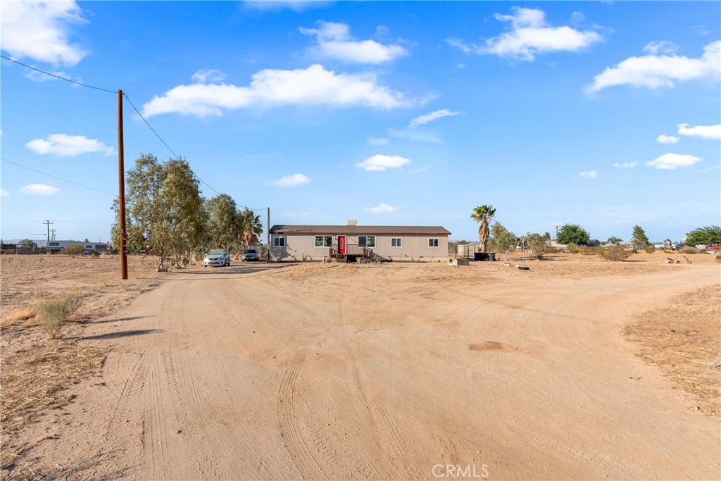 6320 Cholame Road Phelan, CA 92371 - Photo 3 of 33 a view of a road with a building in the background