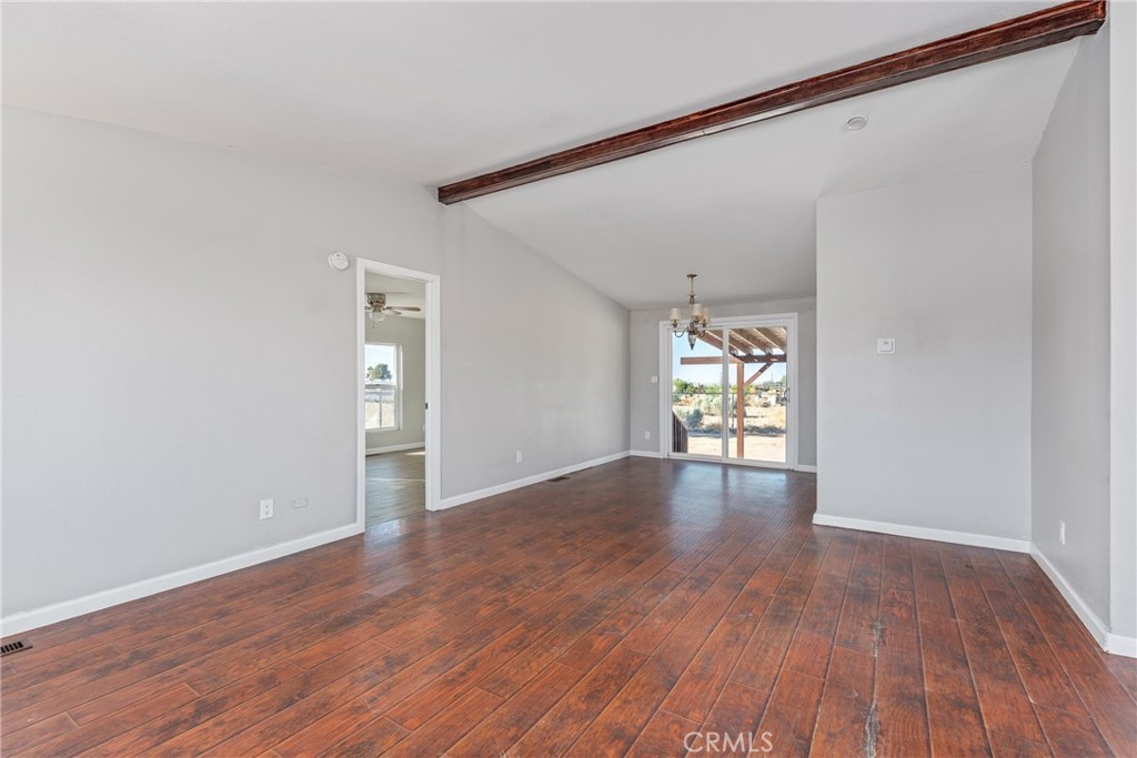 6320 Cholame Road Phelan, CA 92371 - Photo 8 of 33 a view of empty room with wooden floor and fan