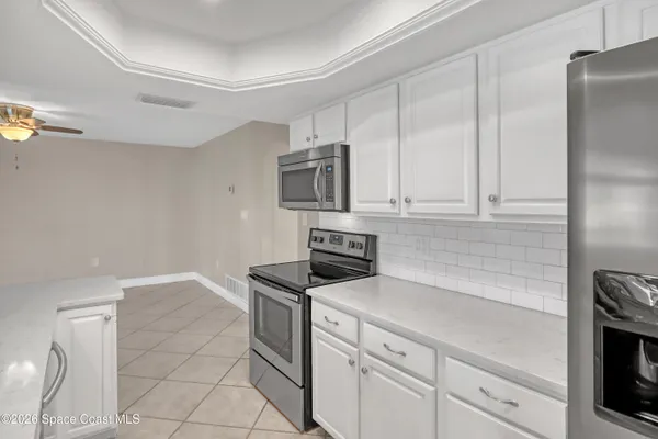 a kitchen with stainless steel appliances granite countertop a sink and cabinets
