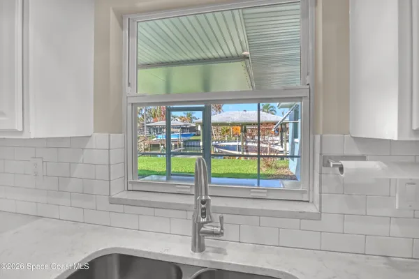 a kitchen with cabinets stainless steel appliances and counter space