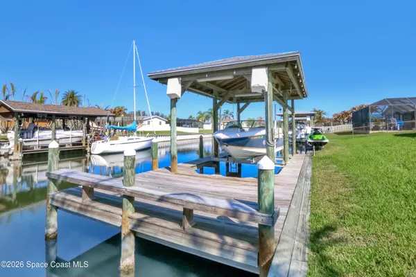 a view of a park with couches in the patio
