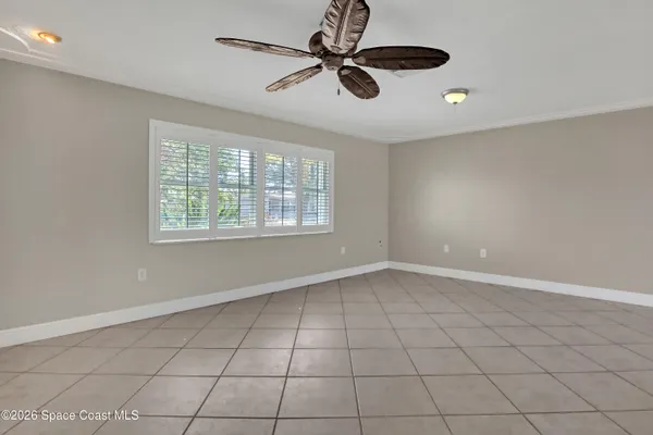 a view of an empty room with windows