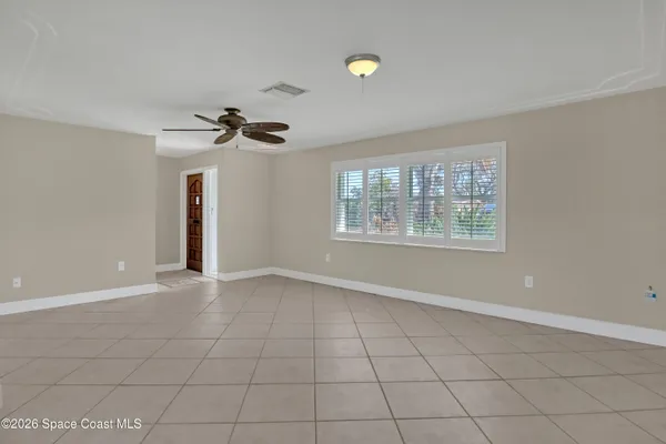 a view of an empty room with a window