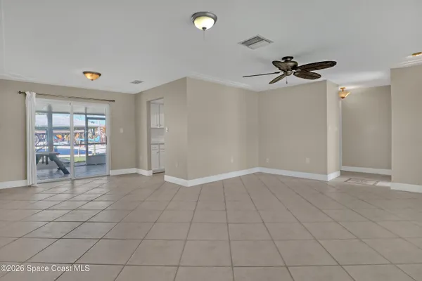 a view of an empty room and a window