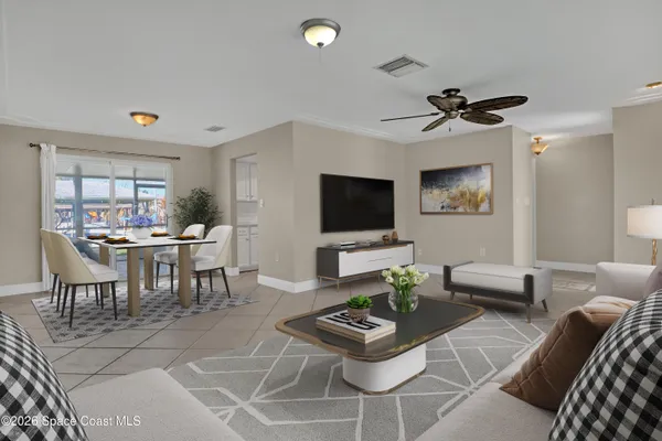 a living room with furniture and a flat screen tv