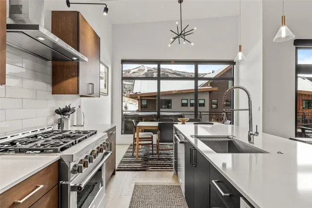 a dining table with chairs and window