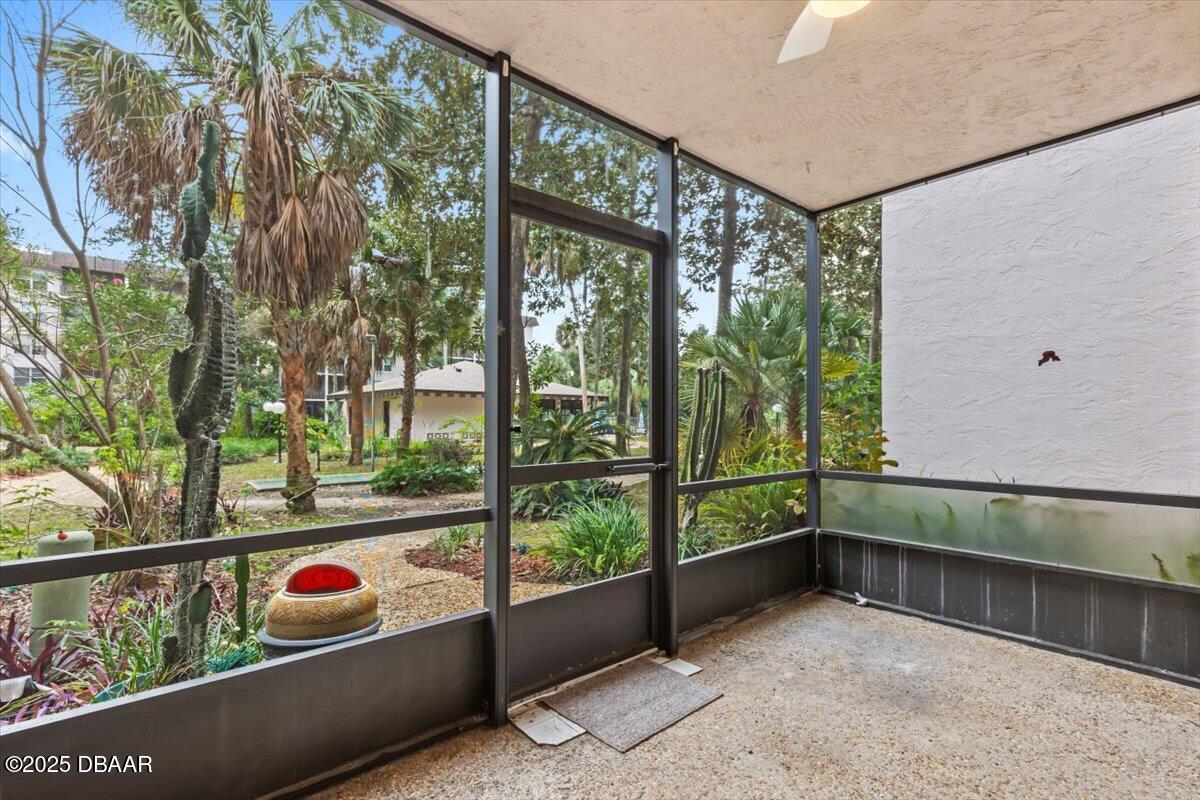 640 North Nova Road, Unit 114 Ormond Beach, FL 32174 - Photo 17 of 40 a balcony with trees in front of it