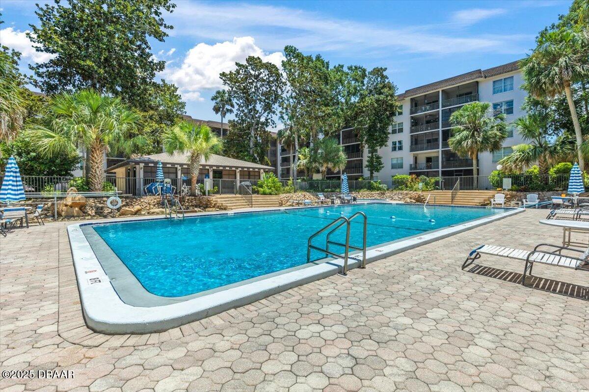 640 North Nova Road, Unit 114 Ormond Beach, FL 32174 - Photo 26 of 40 swimming pool with outdoor seating