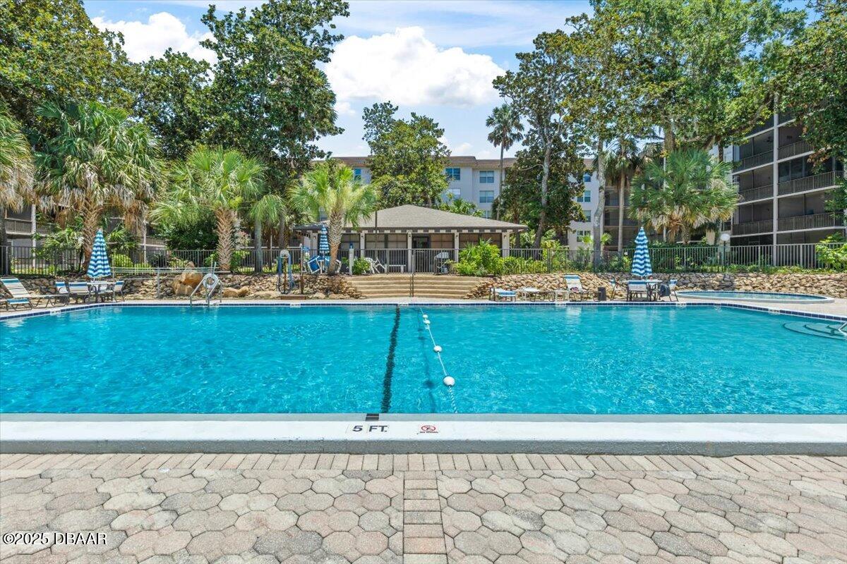 640 North Nova Road, Unit 114 Ormond Beach, FL 32174 - Photo 27 of 40 a view of a house with a yard