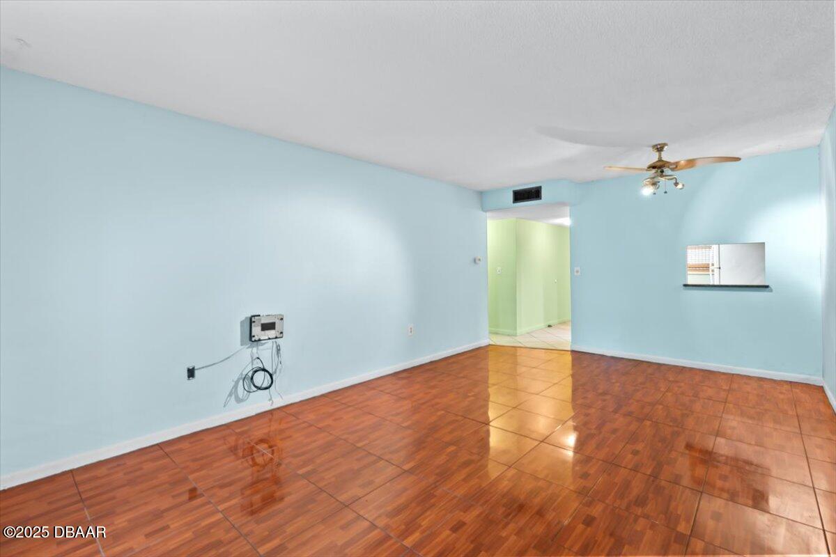 640 North Nova Road, Unit 114 Ormond Beach, FL 32174 - Photo 3 of 40 a view of empty room with wooden floor
