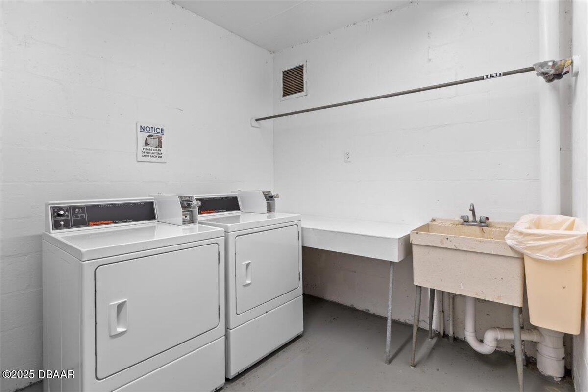640 North Nova Road, Unit 114 Ormond Beach, FL 32174 - Photo 34 of 40 a utility room with dryer and washer