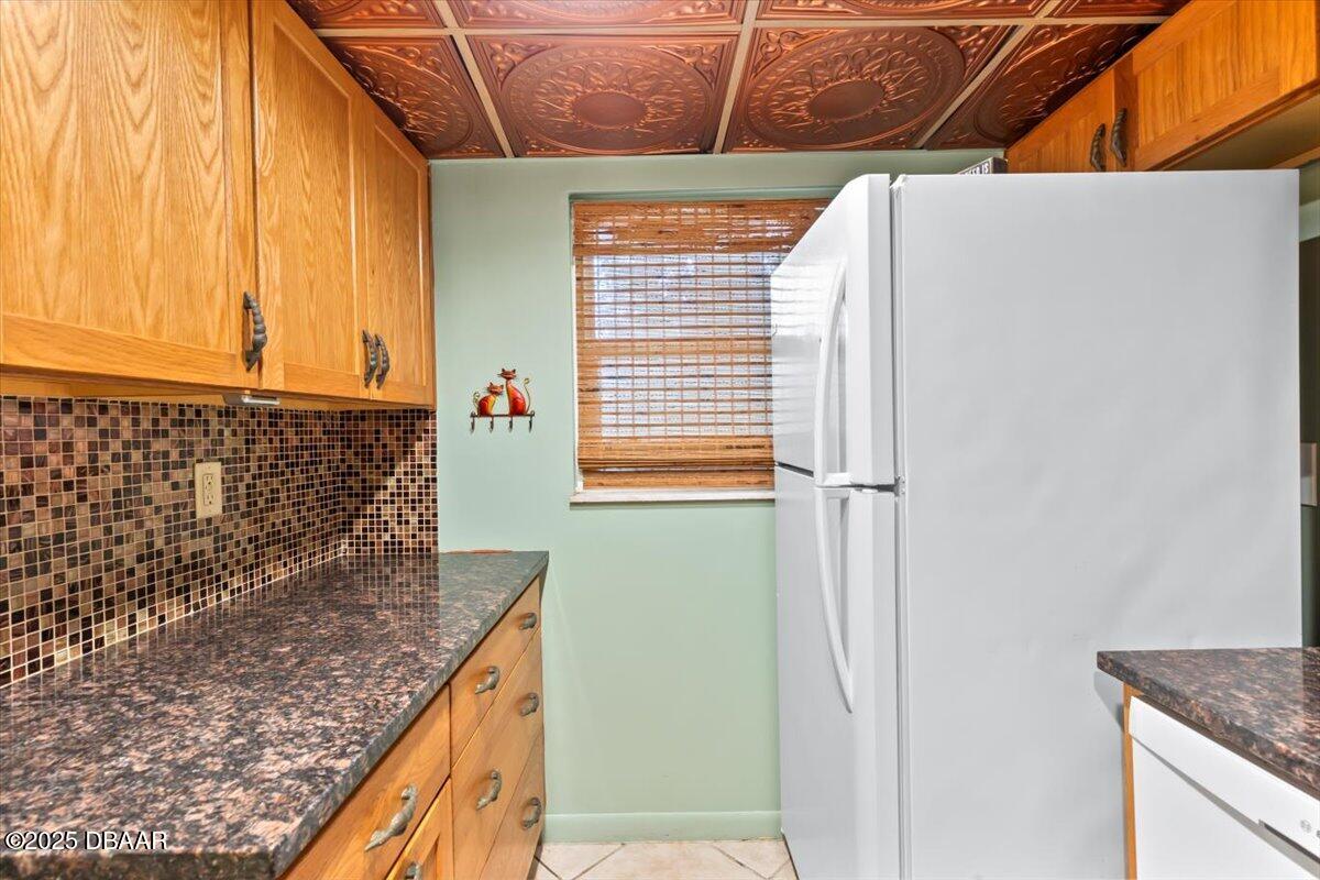 640 North Nova Road, Unit 114 Ormond Beach, FL 32174 - Photo 7 of 40 a bathroom with a granite countertop sink and a mirror