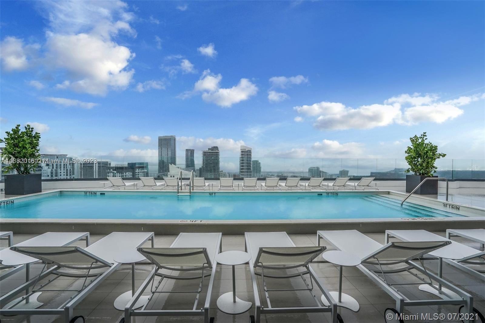 45 Southwest 9th Street, Unit 1908 Miami, FL 33130 - Photo 15 of 51 a view of a chairs and table in the terrace