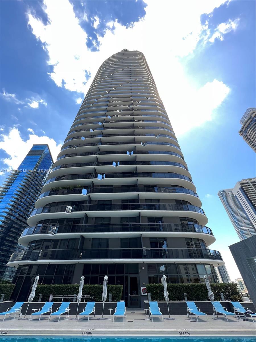 45 Southwest 9th Street, Unit 1908 Miami, FL 33130 - Photo 2 of 51 a view of a tall building next to a road