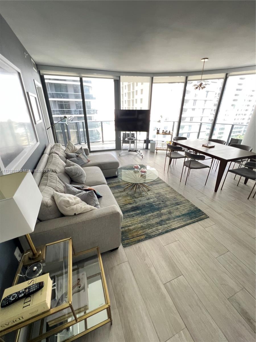 45 Southwest 9th Street, Unit 1908 Miami, FL 33130 - Photo 25 of 51 a living room with furniture and a large window