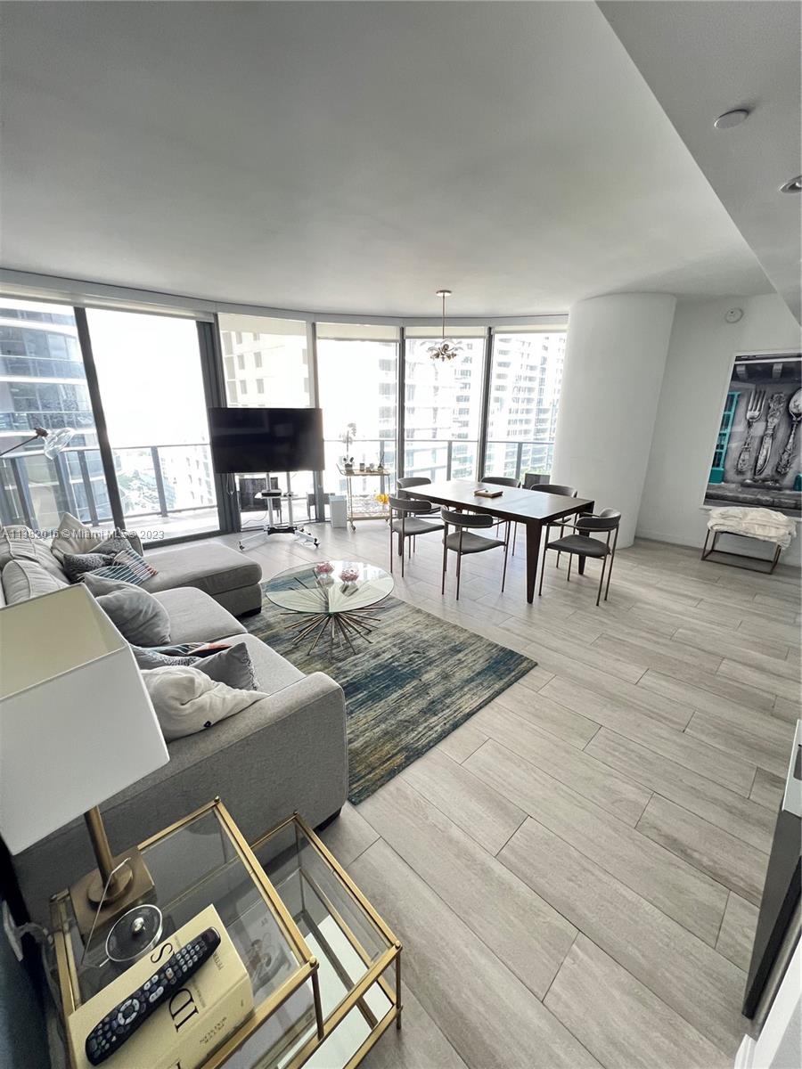 45 Southwest 9th Street, Unit 1908 Miami, FL 33130 - Photo 29 of 51 a living room with furniture and a table