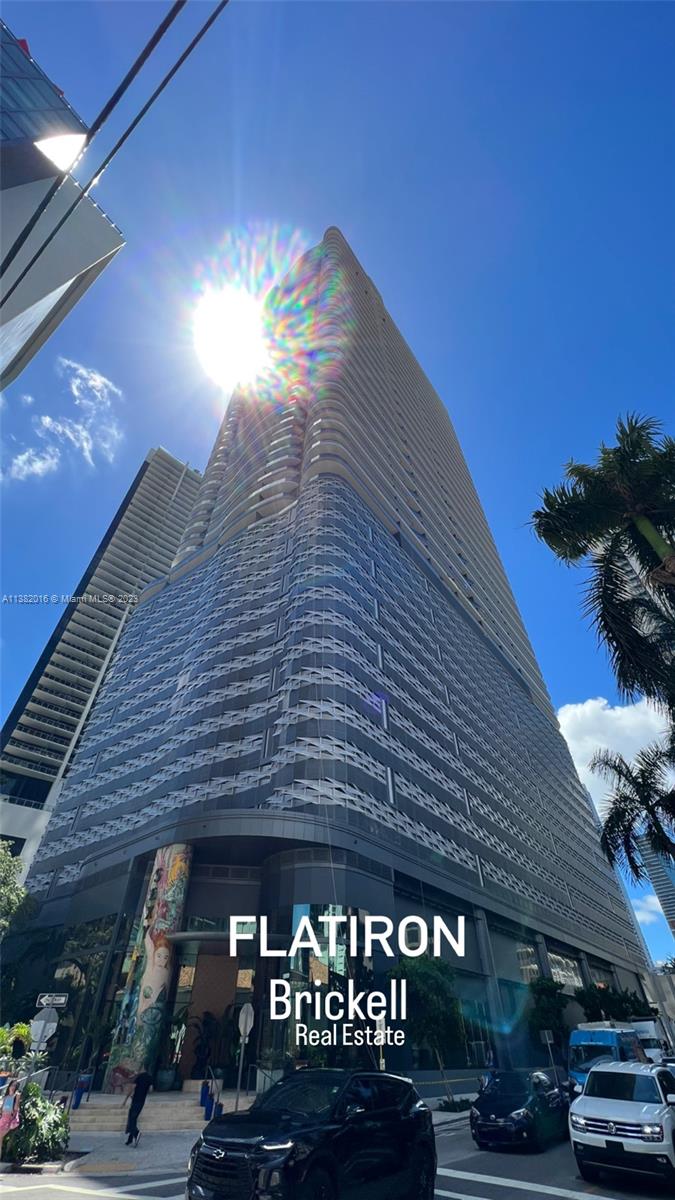 45 Southwest 9th Street, Unit 1908 Miami, FL 33130 - Photo 3 of 51 a roof deck with table and chairs with potted plants