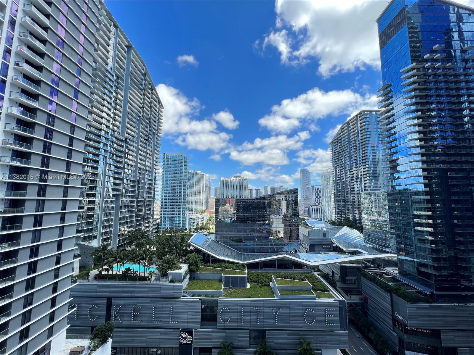 45 Southwest 9th Street, Unit 1908 Miami, FL 33130 - Photo 34 of 51 a view of a chairs and table in a backyard