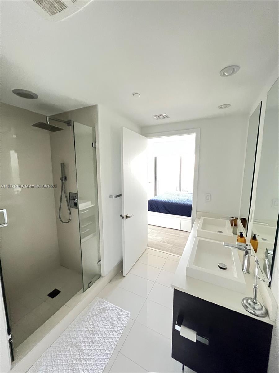 45 Southwest 9th Street, Unit 1908 Miami, FL 33130 - Photo 42 of 51 a bathroom with a sink a toilet and shower