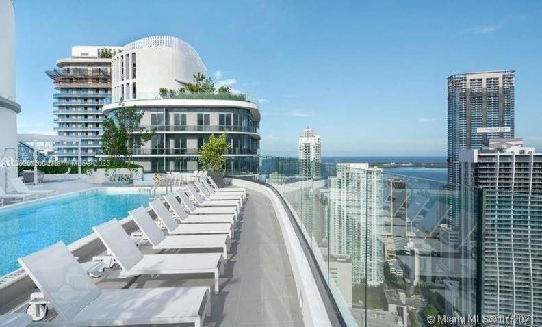 45 Southwest 9th Street, Unit 1908 Miami, FL 33130 - Photo 6 of 51 a view of balcony with couch and outdoor seating