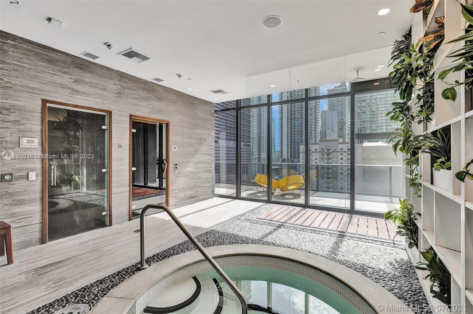 45 Southwest 9th Street, Unit 1908 Miami, FL 33130 - Photo 9 of 51 a building outdoor space with patio furniture and potted plants