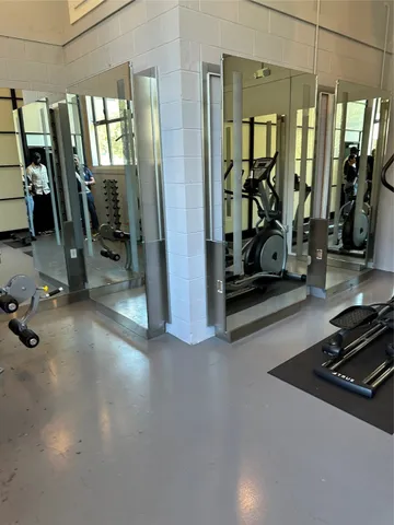 a view of a garage with gym equipment