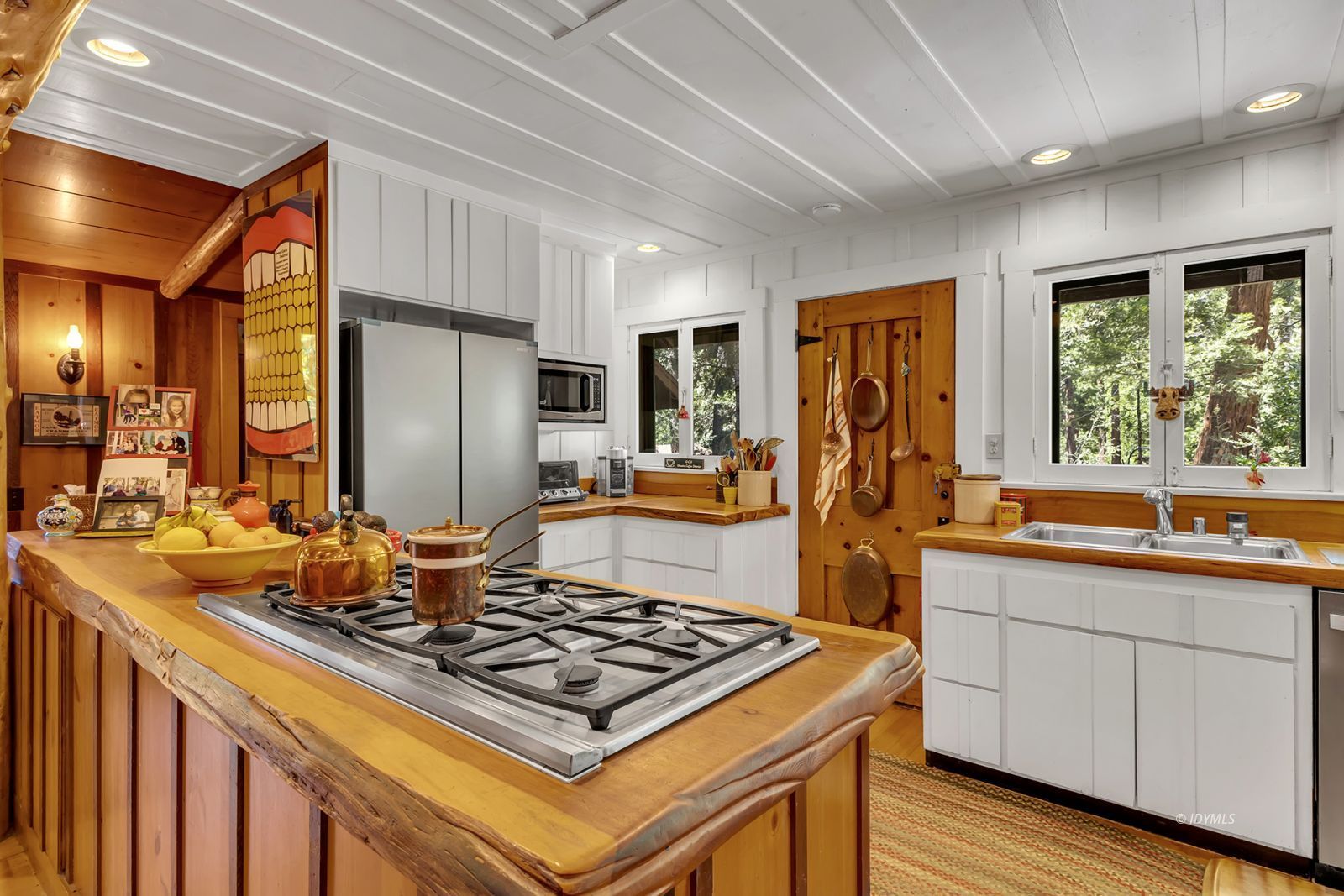 25100 Indian Rock Road Idyllwild, CA 92549 - Photo 29 of 75 a kitchen with kitchen island granite countertop a sink stove and refrigerator