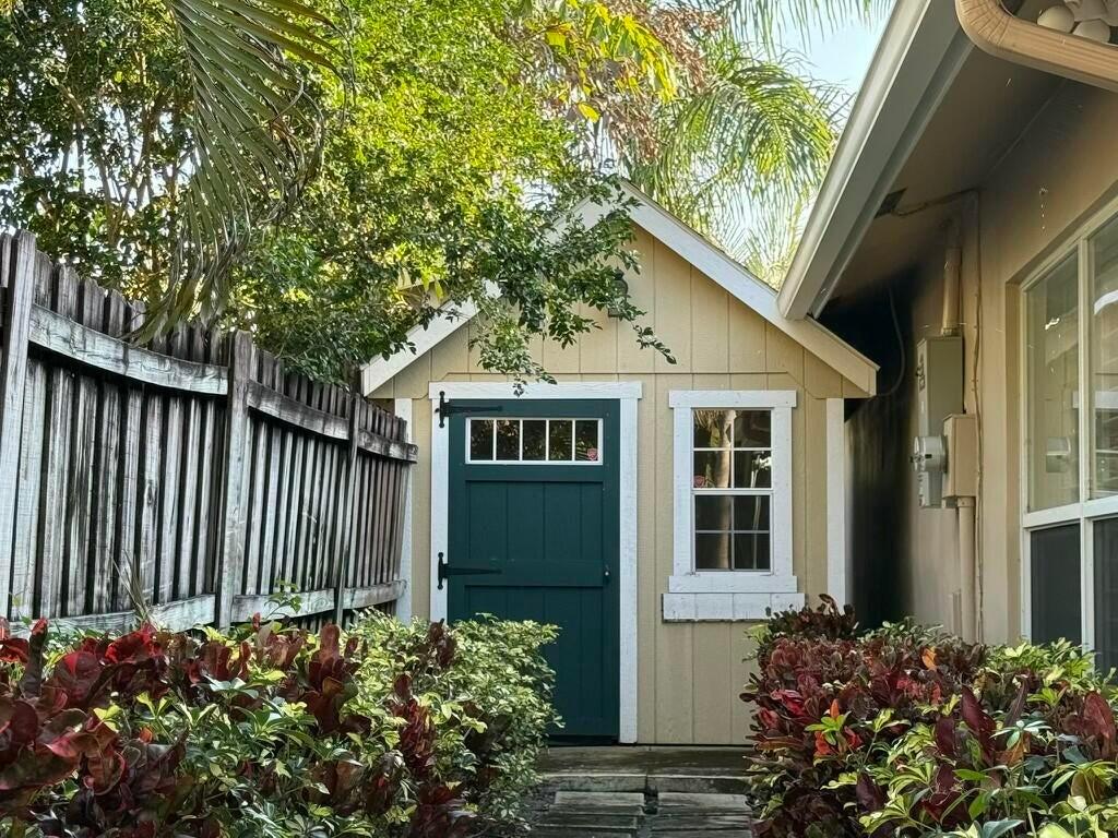 5777 Wind Drift Lane Boca Raton, FL 33433 - Photo 15 of 15 a front view of a house with garden