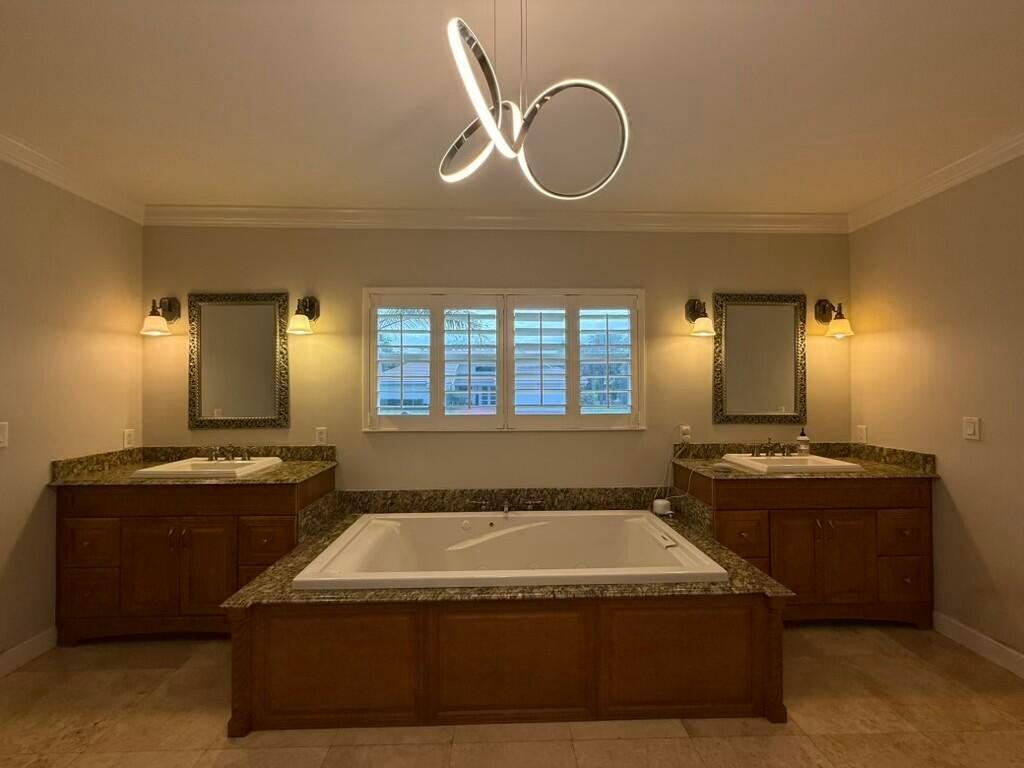 5777 Wind Drift Lane Boca Raton, FL 33433 - Photo 5 of 15 a spacious bathroom with a granite countertop sink a mirror and a bathtub