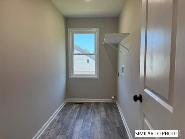 a view of a small space with wooden floor