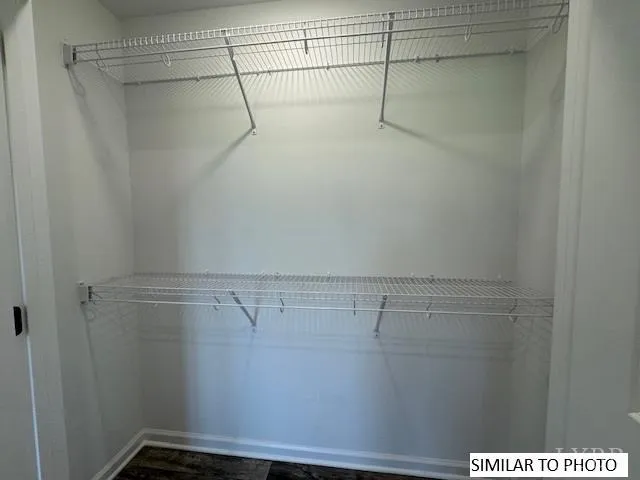 a view of a room with racks on the wall