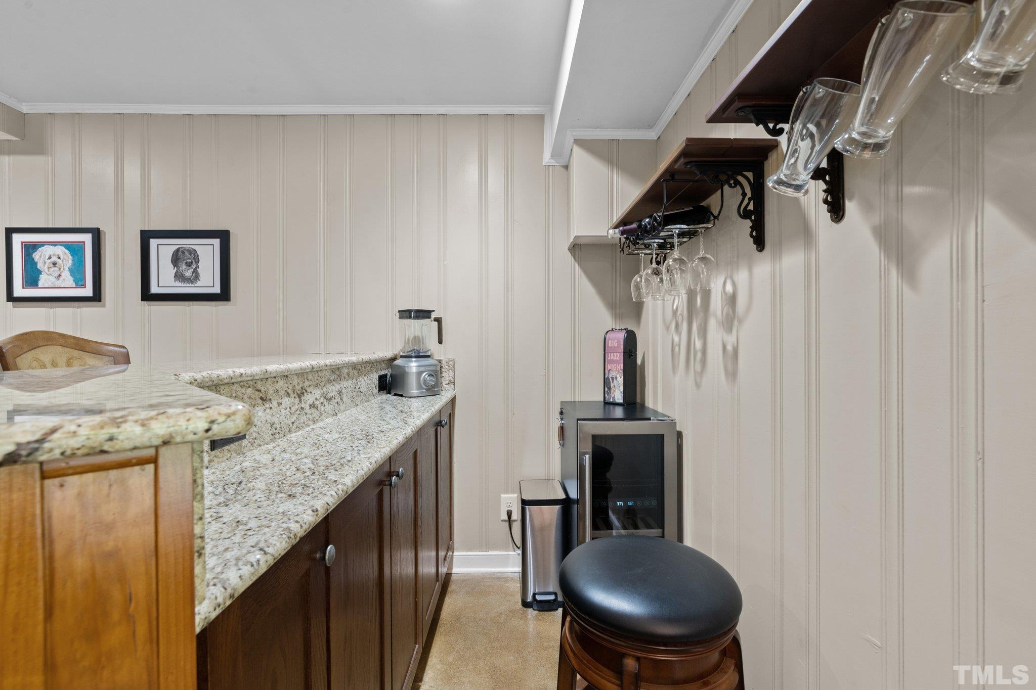 4116 Spruce Drive Raleigh, NC 27612 - Photo 20 of 51 a kitchen with a granite countertop sink a stove and chairs