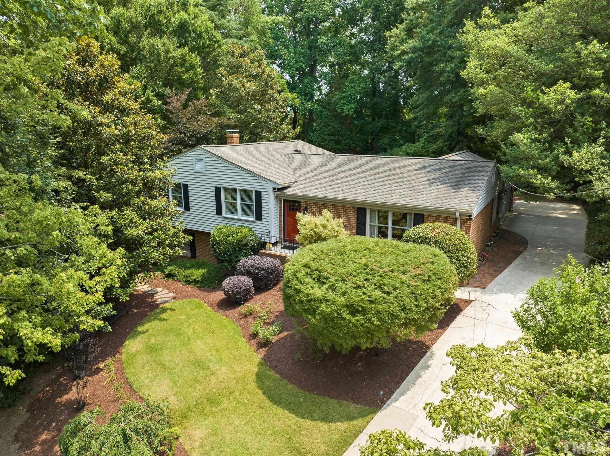 4116 Spruce Drive Raleigh, NC 27612 - Photo 2 of 51 a front view of a house with garden