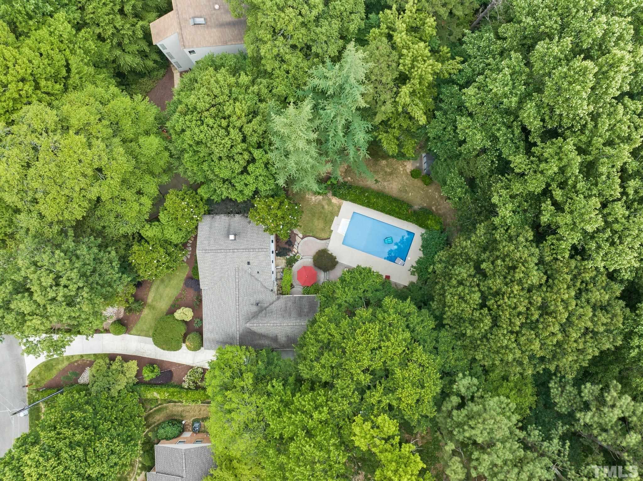 4116 Spruce Drive Raleigh, NC 27612 - Photo 4 of 51 an aerial view of a house with a yard and trees