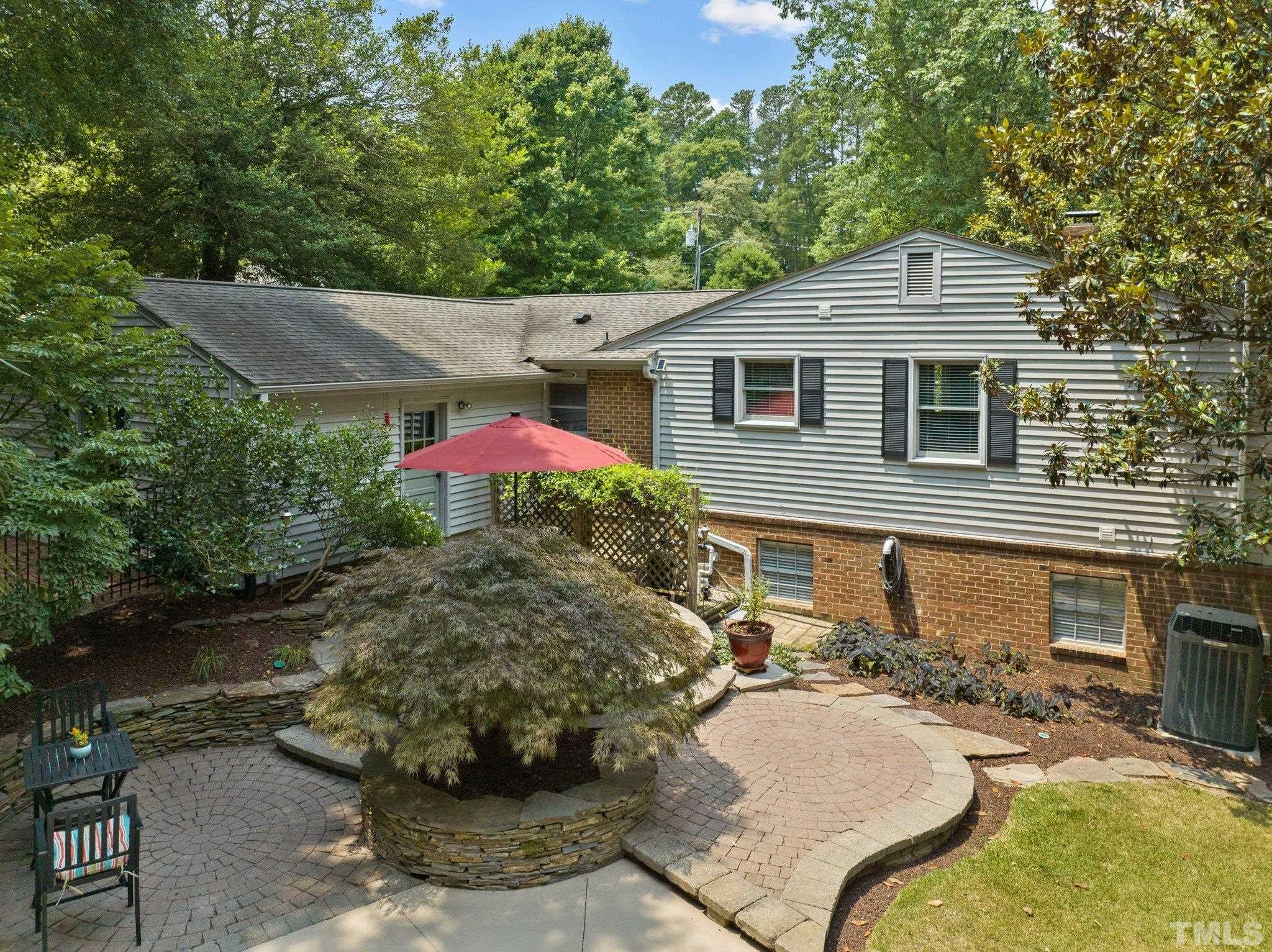 4116 Spruce Drive Raleigh, NC 27612 - Photo 43 of 51 a backyard of a house with yard fire pit and outdoor seating