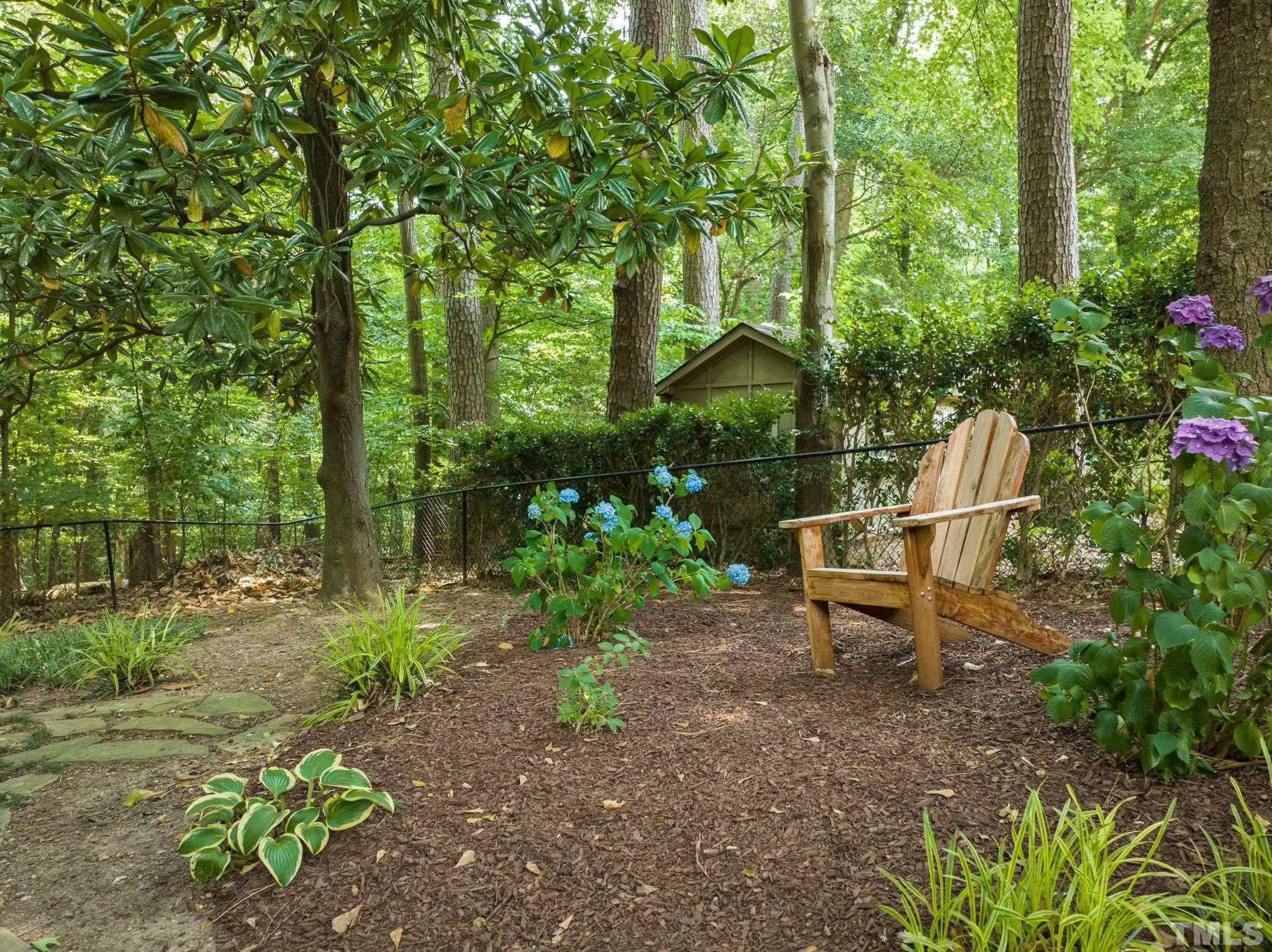 4116 Spruce Drive Raleigh, NC 27612 - Photo 44 of 51 a view of a bench in a garden