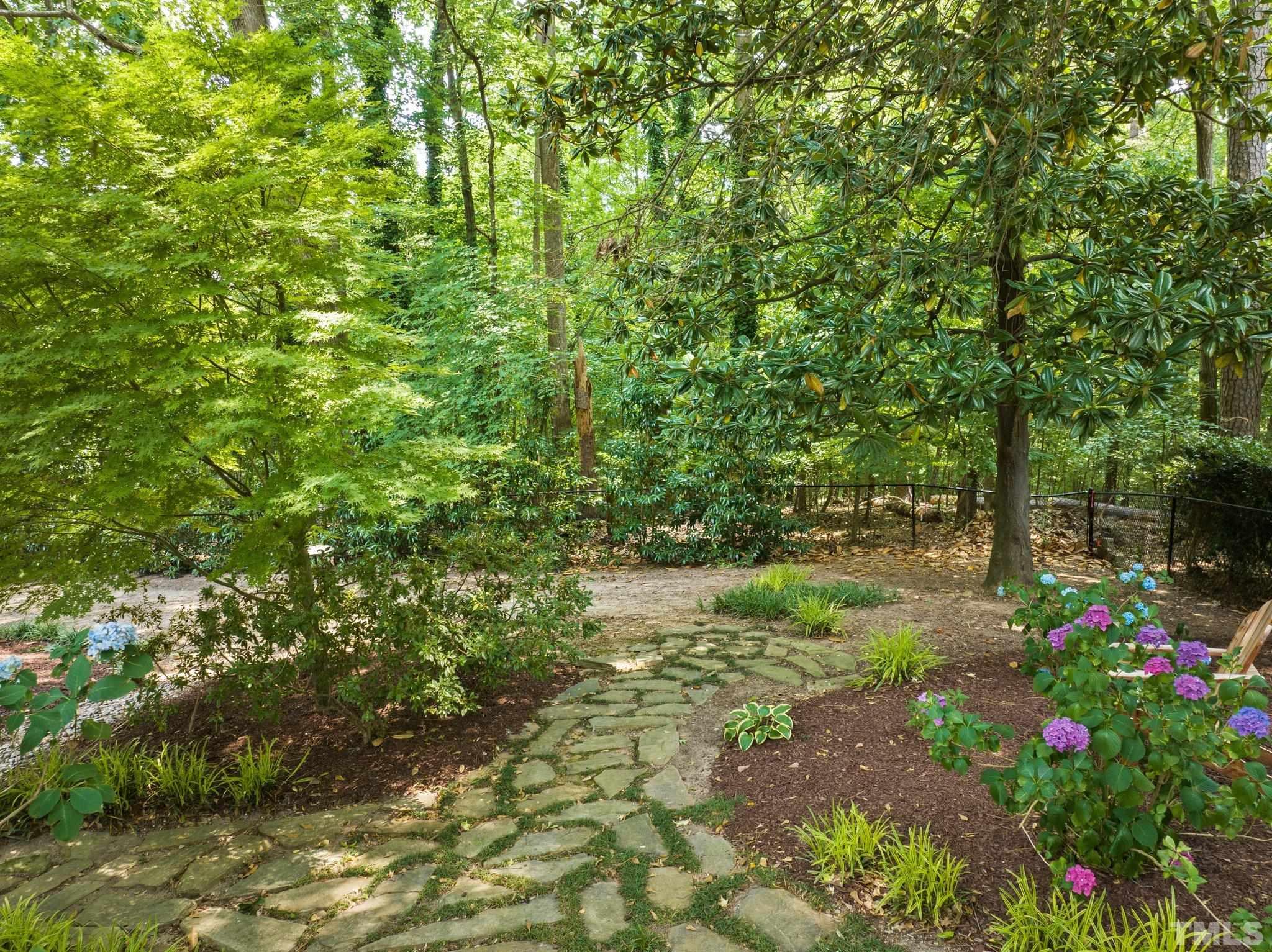4116 Spruce Drive Raleigh, NC 27612 - Photo 45 of 51 a view of a yard with a tree