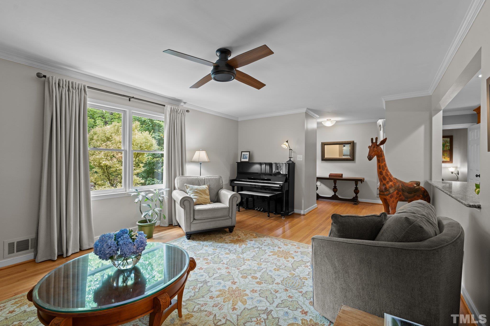 4116 Spruce Drive Raleigh, NC 27612 - Photo 8 of 51 a living room with furniture and a large window