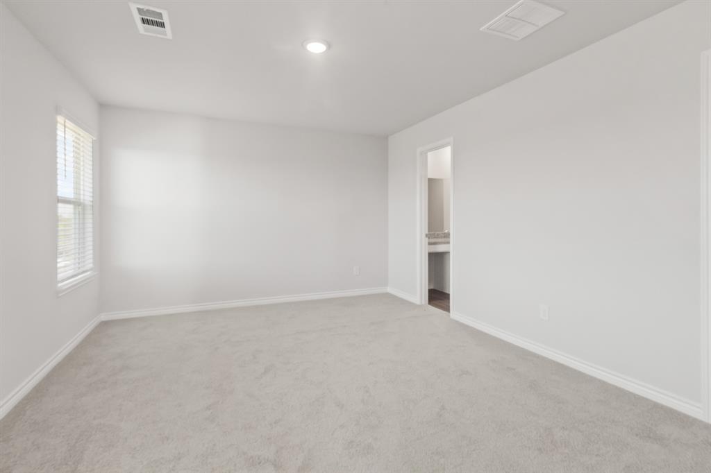 1128 Runway Road Fort Worth, TX 76131 - Photo 11 of 18 an empty room with windows