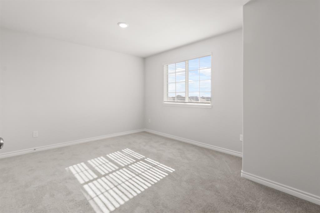 1128 Runway Road Fort Worth, TX 76131 - Photo 12 of 18 an empty room with windows