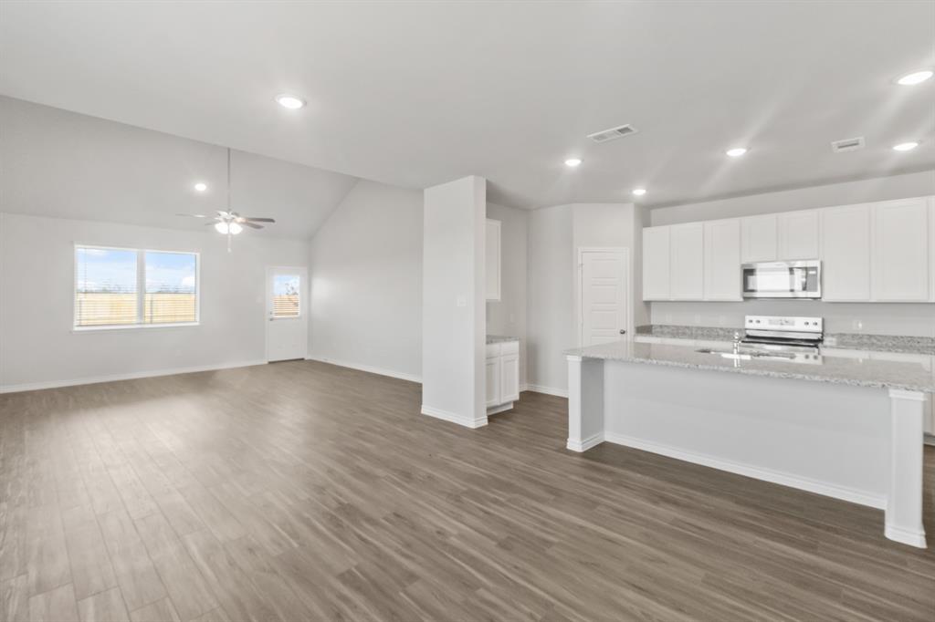 1128 Runway Road Fort Worth, TX 76131 - Photo 2 of 18 an empty room with wooden floor and window