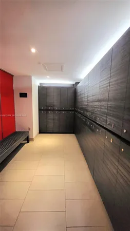 a kitchen with stainless steel appliances kitchen island granite countertop a refrigerator and a stove