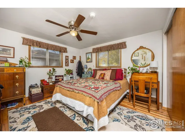 a living room with furniture and a clock