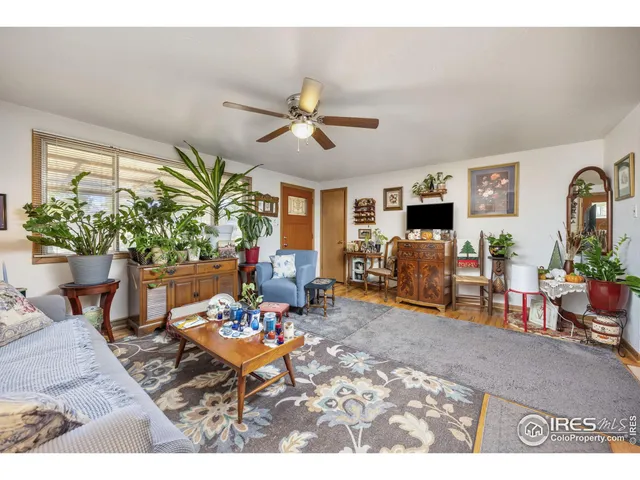 a living room with furniture dining table and a fireplace