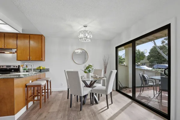 a view of a dining room with furniture window and wooden floor