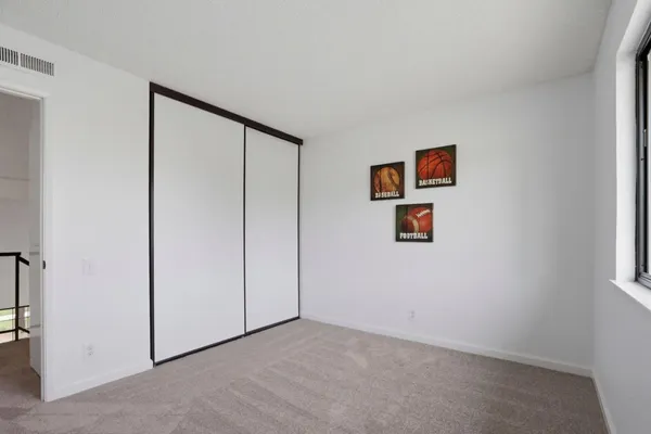 an empty room with a view of a closet